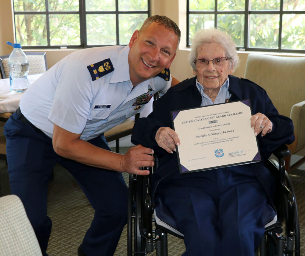 CWO3 Jared Esselman and Auxiliarist Pat Swope.